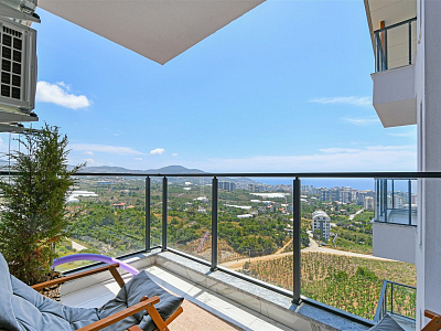 Стильная квартира 1+1 с мебелью и видом на море в районе Махмутлар