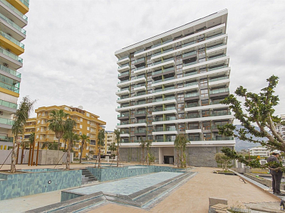 Апартаменты 2+1 с панорамными окнами и видом на море в районе Махмутлар