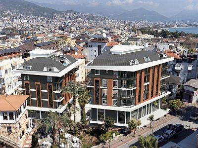 Современный жилой проект в центре Алании с удобными планировками 1+1, 2+1 и 3+1