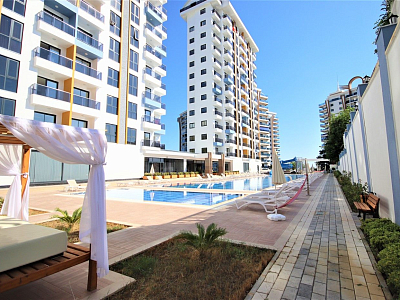 Меблированные апартаменты с планировкой 1+1 в районе Махмутлар