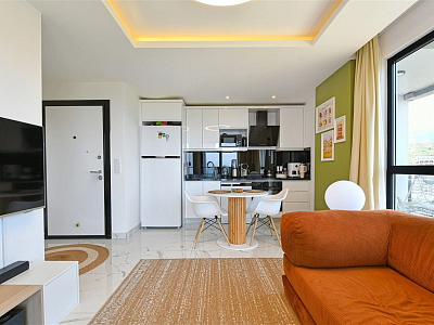 Стильная квартира 1+1 с мебелью и видом на море в районе Махмутлар