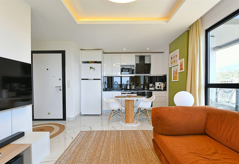 Стильная квартира 1+1 с мебелью и видом на море в районе Махмутлар