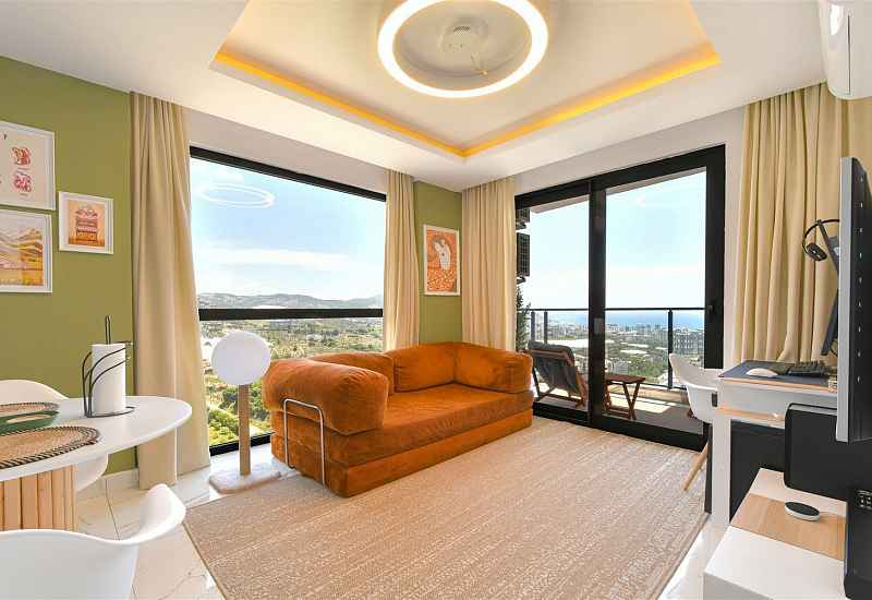 Стильная квартира 1+1 с мебелью и видом на море в районе Махмутлар