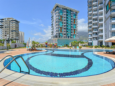 Стильная квартира 1+1 с мебелью и видом на море в районе Махмутлар