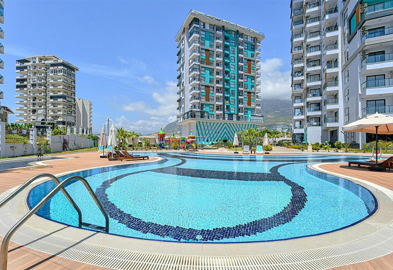 Стильная квартира 1+1 с мебелью и видом на море в районе Махмутлар