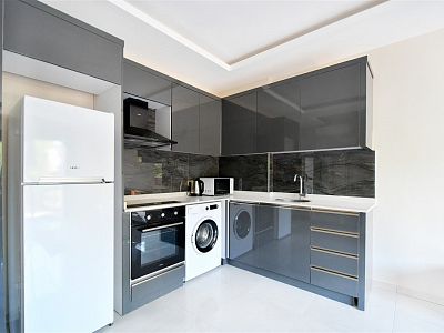 Новые апартаменты 1+1 с мебелью - район Махмутлар
