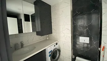 Стильная квартира 1+1 в районе Махмутлар