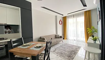 Стильная квартира 1+1 в районе Махмутлар